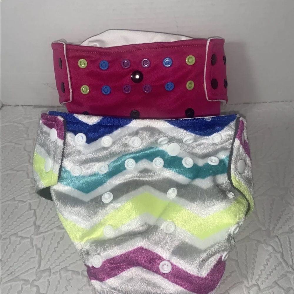 Lot of (2) go green cloth diapers pink adjustable. 

The pink ones have the logo